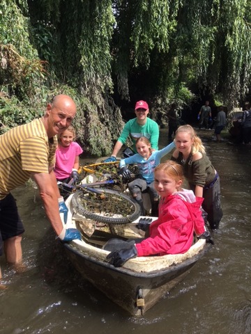 The girls keep an eye on the growing rubbish collection